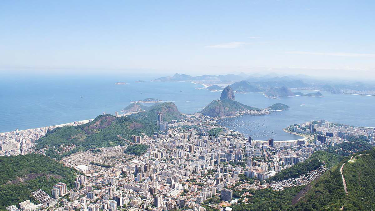 nature aerial photography of city near body of water at daytime landscape